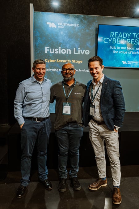 three men at Trustmarque Fusion on stage.
