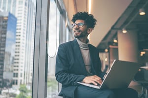 Man sitting by the window and looking away